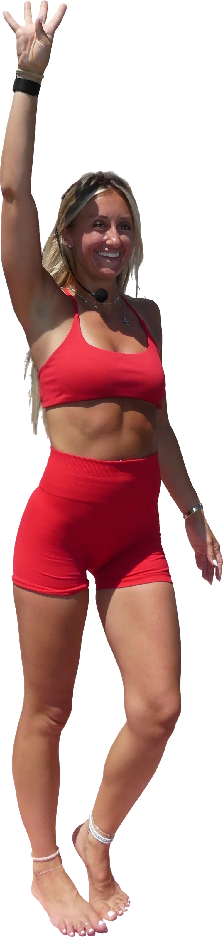 Ashley teaching, one arm raised