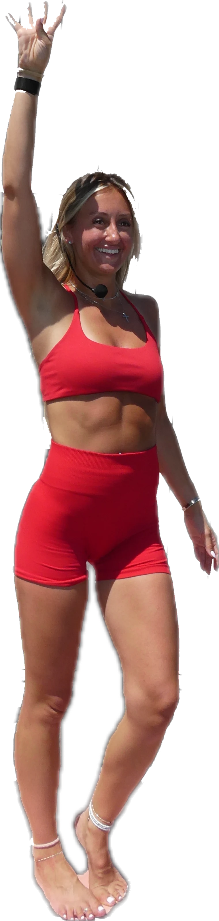 Ashley teaching, one arm raised