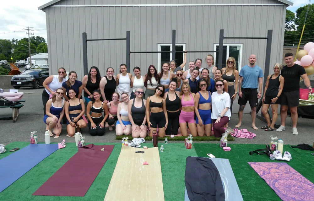 A full outdoor pop-up class, mats laid out in a row